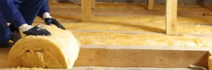 Fiberglass insulation being installed